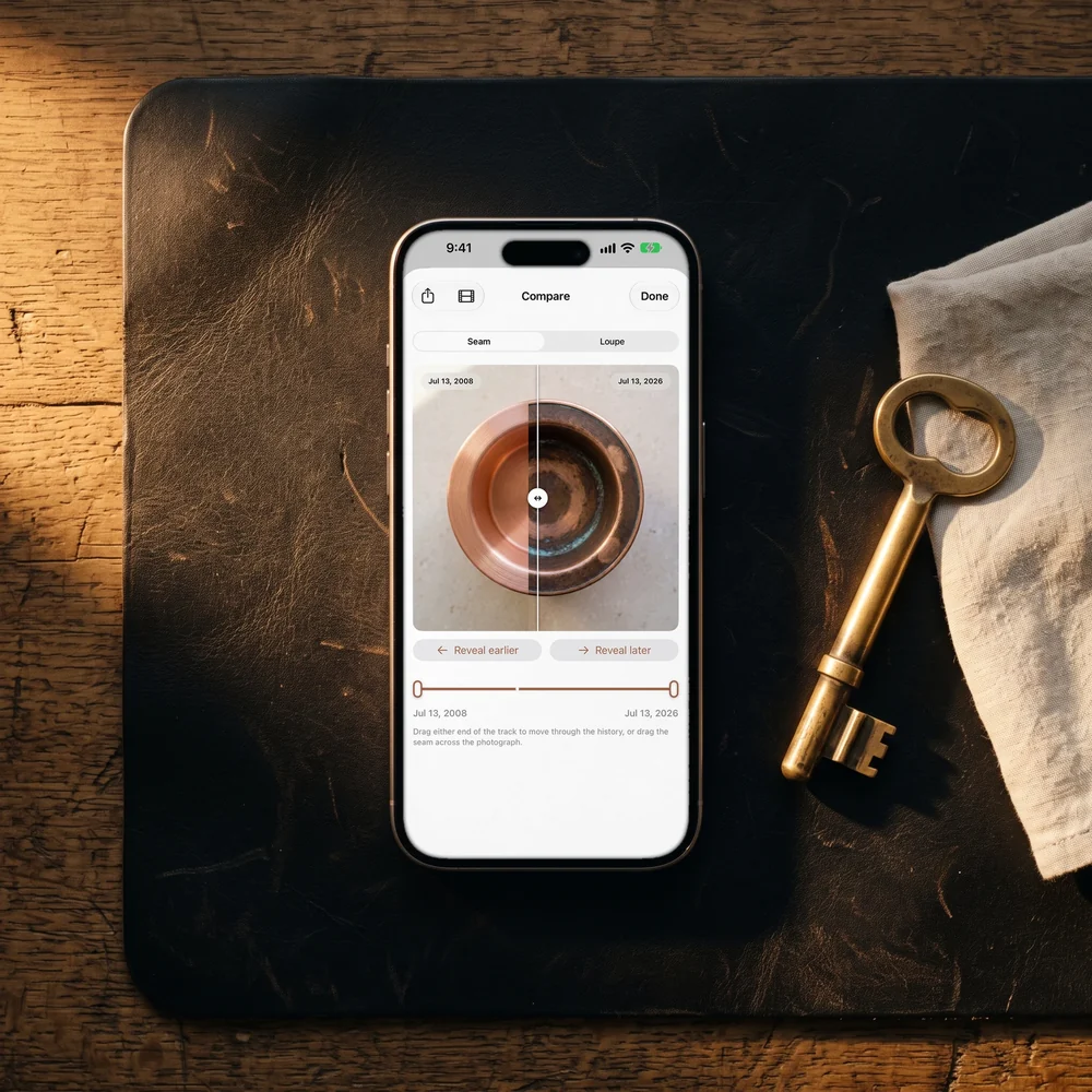 Patina on an iPhone, comparing two photographs of a copper bowl, on a leather desk pad beside an old brass key